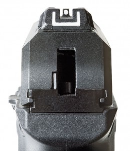 The drift-adjustable U-shaped rear and white-dot front sights sit within large dovetails.