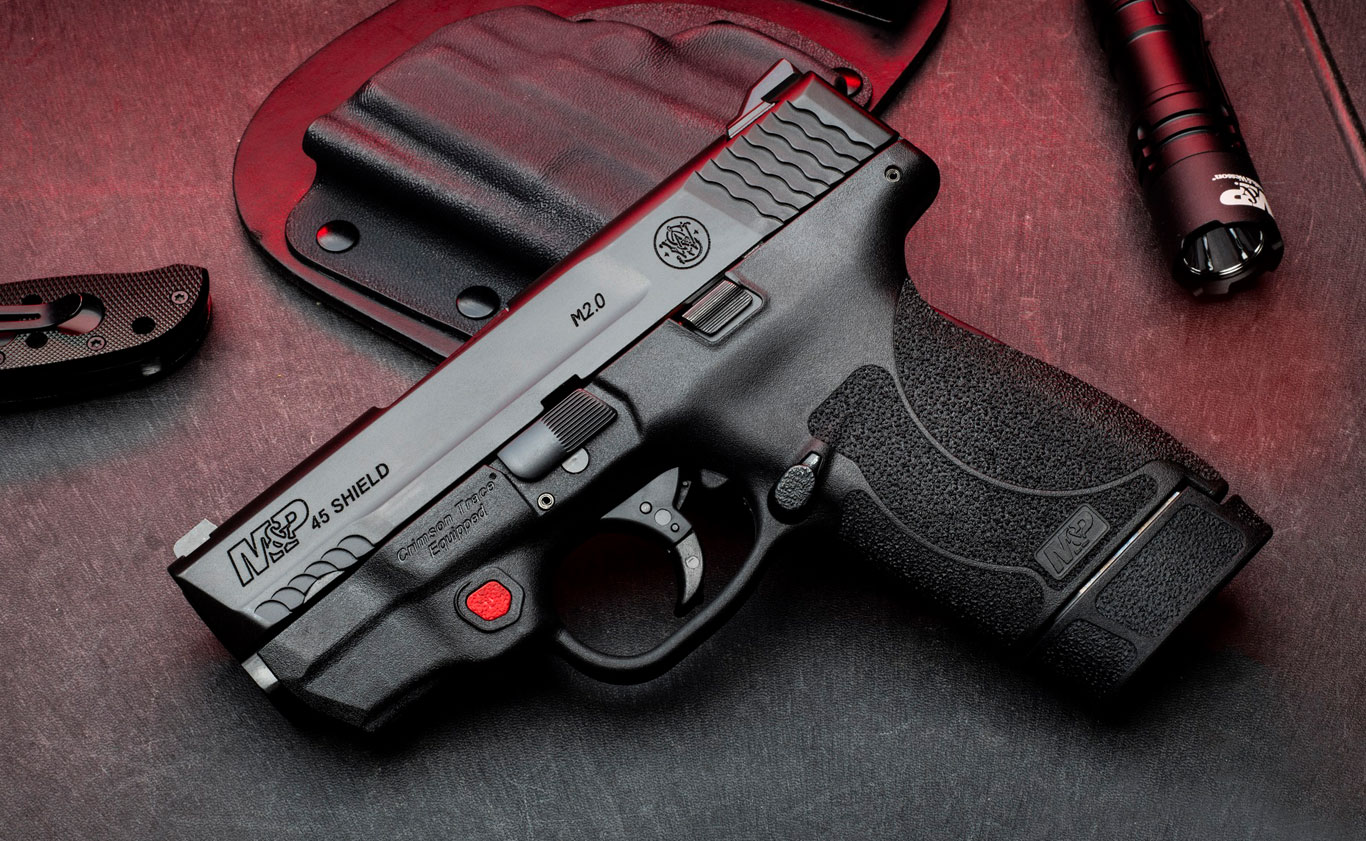 M&P 45 Shield M2.0 pistol with integrated Crimson Trace red and green laser, chambered in .45 Auto.