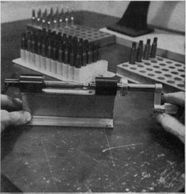 Trimming of the brass cases, if necessary, is performed after resizing. Undue lengthening of cases can increase chamber pressures. This is the Forster-Appelt col/et-type trimmer.